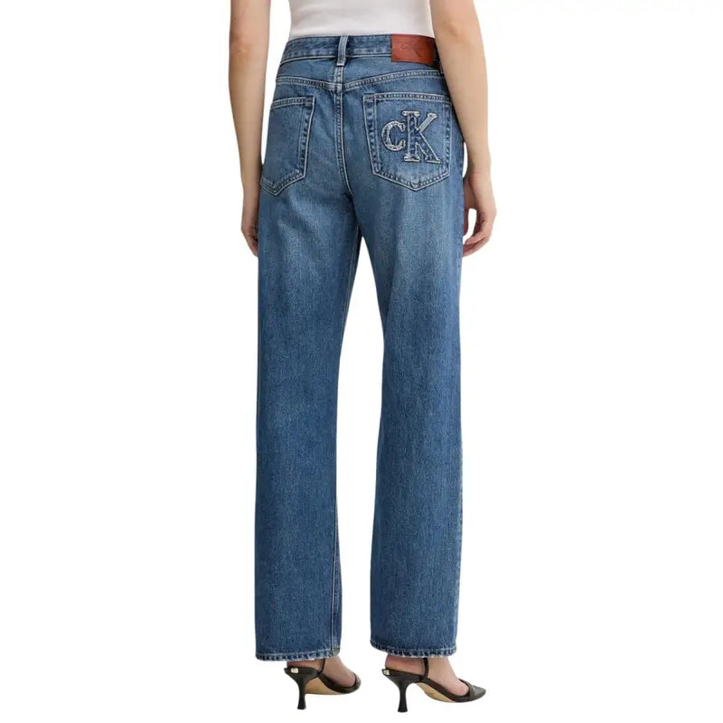 Back side of Calvin Klein women’s light blue cotton denim jeans with embroidered ck logo and brown leather patch