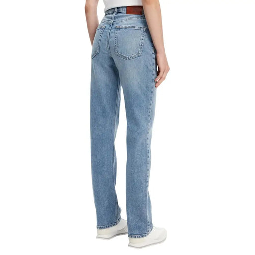 Calvin Klein women’s light blue cotton jeans with light-wash denim straight-leg cut and brown leather belt loop