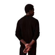 Calvin Klein wool sweater for women in black with classic collar and ribbed cuffs, front view