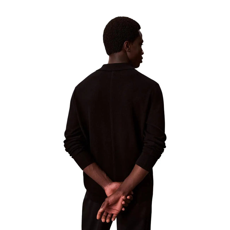 Calvin Klein wool sweater for women in black with classic collar and ribbed cuffs, front view