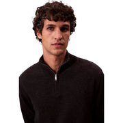Calvin Klein wool turtleneck sweater for men in black merino wool with silver half-zipper, front view