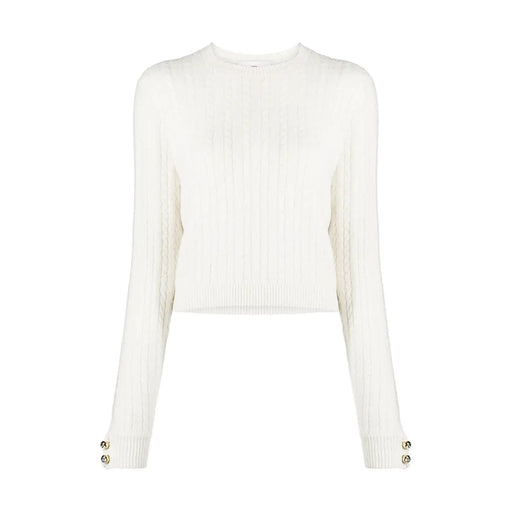 Pull en maille de laine couleur crème de Chiara Ferragni, à manches longues côtelées et boutons de poignet dorés.
