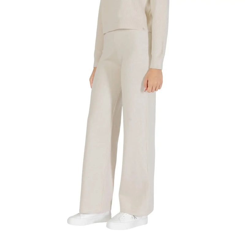 Cream-colored wide-leg choral women knit trousers in a viscose blend fabric tailored for fall winter wear
