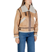 Tan shearling bomber jacket with white plush fur collar cuffs and dark brown leather trim for women