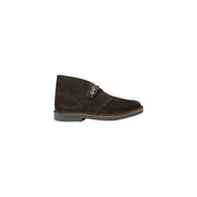 Dark brown suede clarks desert boot with classic chukka design and contrasting stitching for men