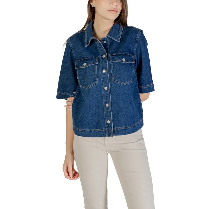 Classic blue short sleeve cotton shirt for women featuring button closures and denim jacket style design
