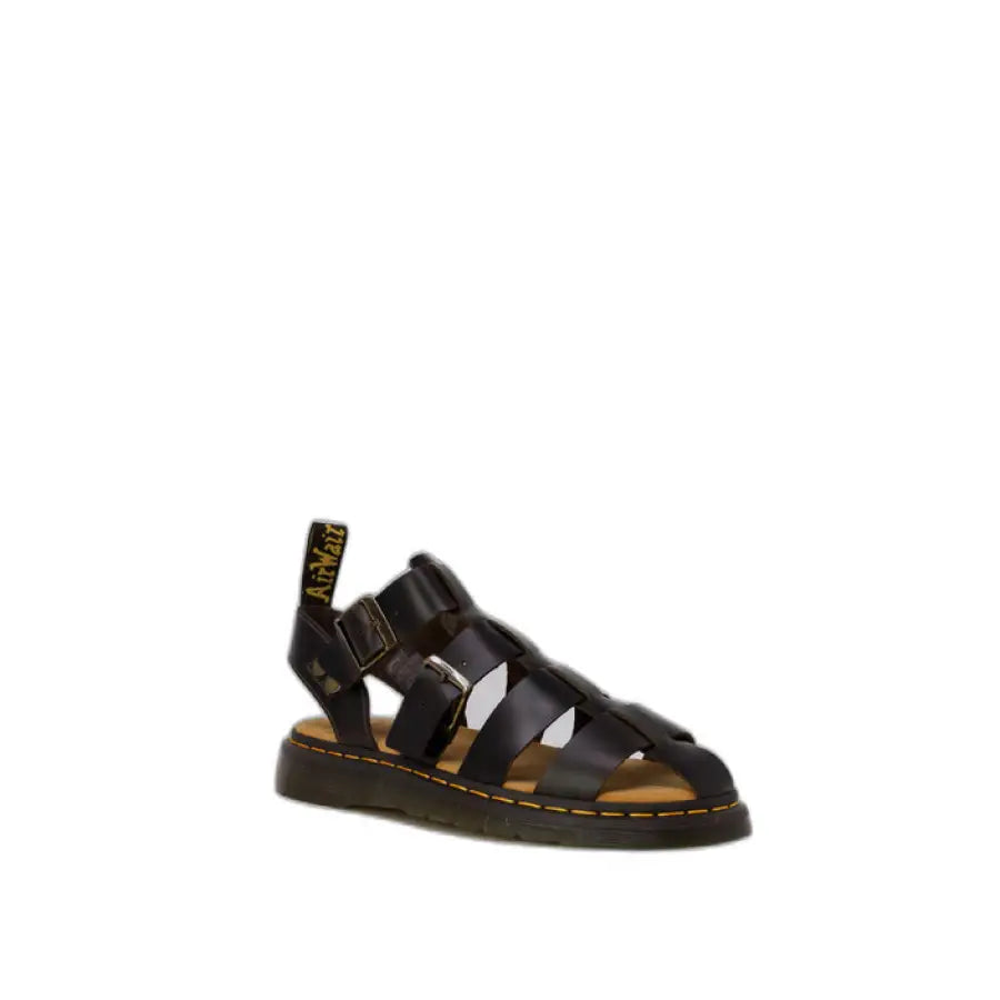 
                      
                        Black Dr. Martens sandal close-up, urban city style buckle detail
                      
                    