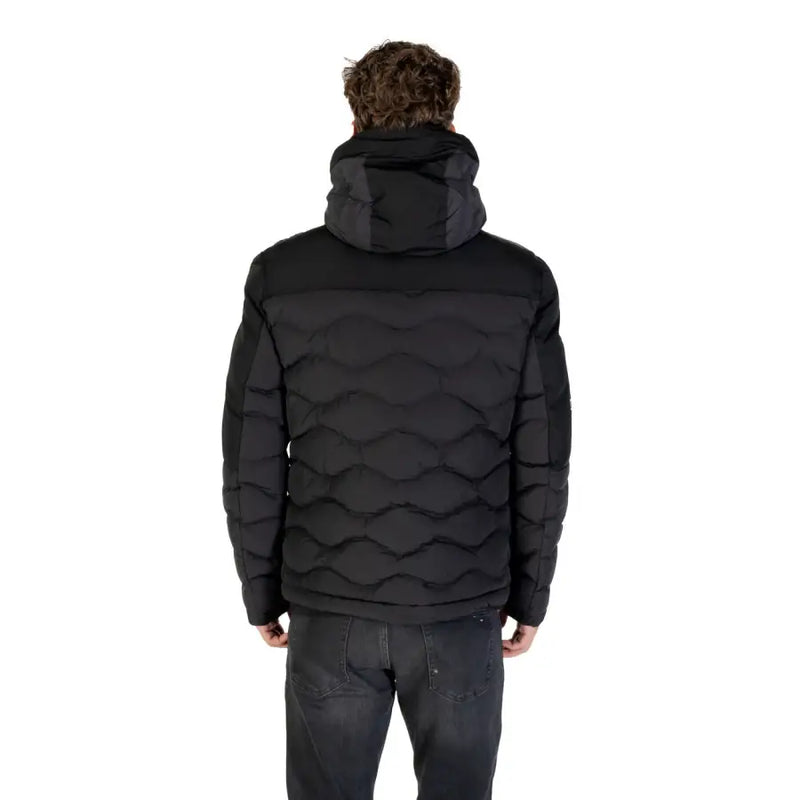 Black quilted puffer jacket with fur-lined hood and wave pattern on the back