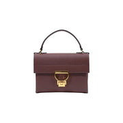 A burgundy pebbled leather handbag with black top handle and gold-tone d-shaped clasp from Coccinelle Arlettis 24cm collection
