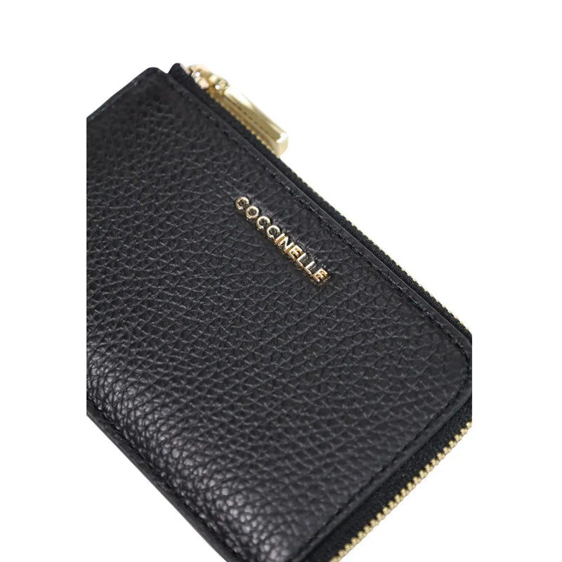 Black textured leather zip wallet with gold-tone hardware and coccinelle branding in size W13 H8.5 L0