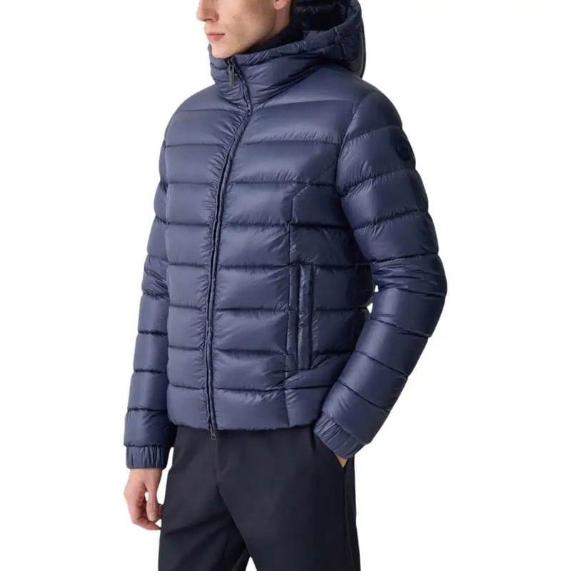 Navy blue down jacket with hood and quilted design, likely from a popular outdoor brand.
