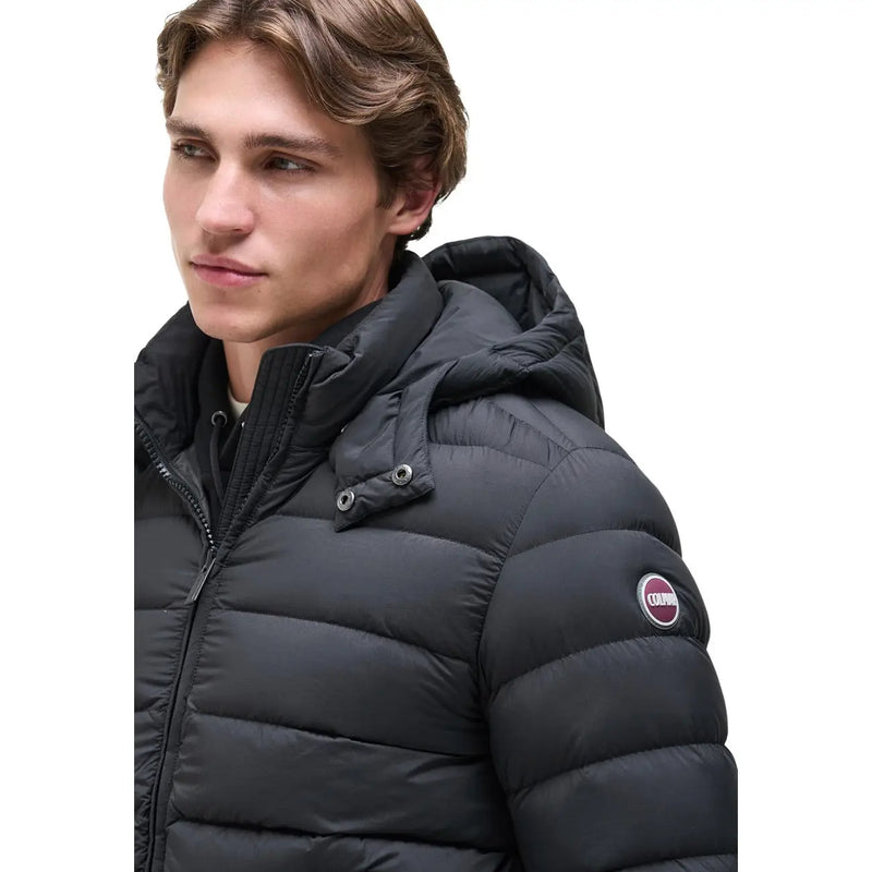 Colmar Originals puffer jacket for men in black with quilted design hood and circular logo on sleeve, front view