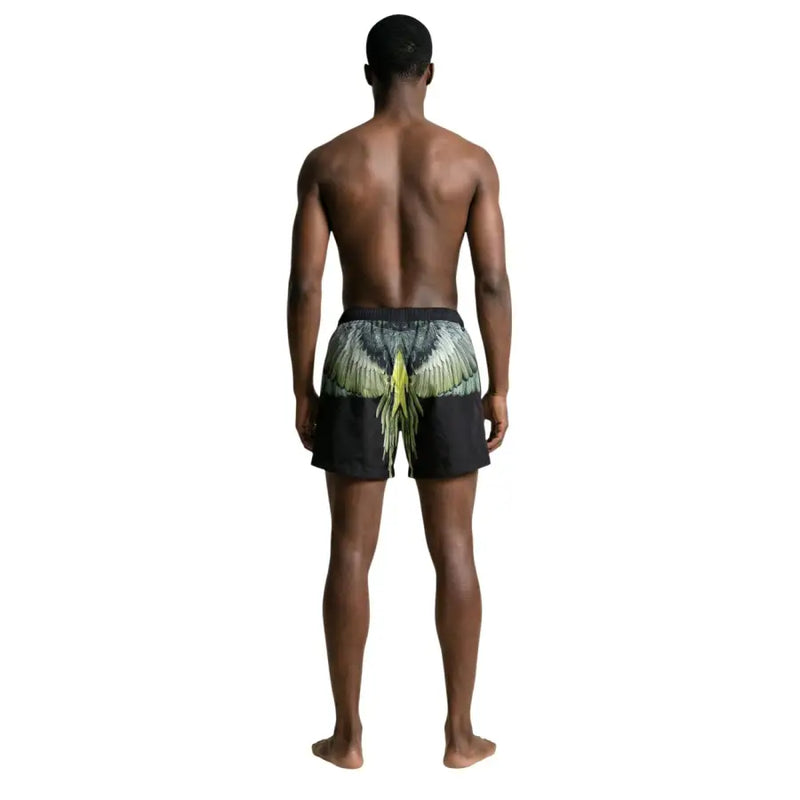County of Milan Herren-Badehose, schwarze Polyester-Shorts mit Print und grünem und gelbem Flügelmotiv auf der Rückseite
