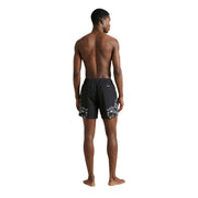 County of Milan men swimwear black printed polyester shorts with bold white floral pattern on lower legs