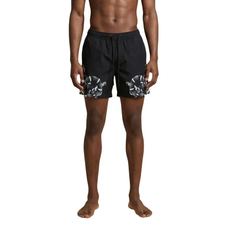 Black swim trunks by County of Milan featuring bold white snake pattern on lower legs for men swimwear