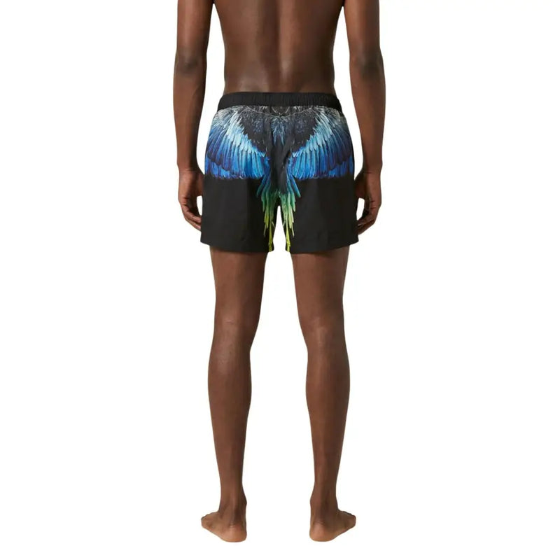 Black swim trunks by County Of Milan featuring a vibrant blue and green wing design for men swimwear use