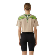 County of Milan women beige cotton short-sleeved crop top with vibrant green and white wing graphic across shoulders