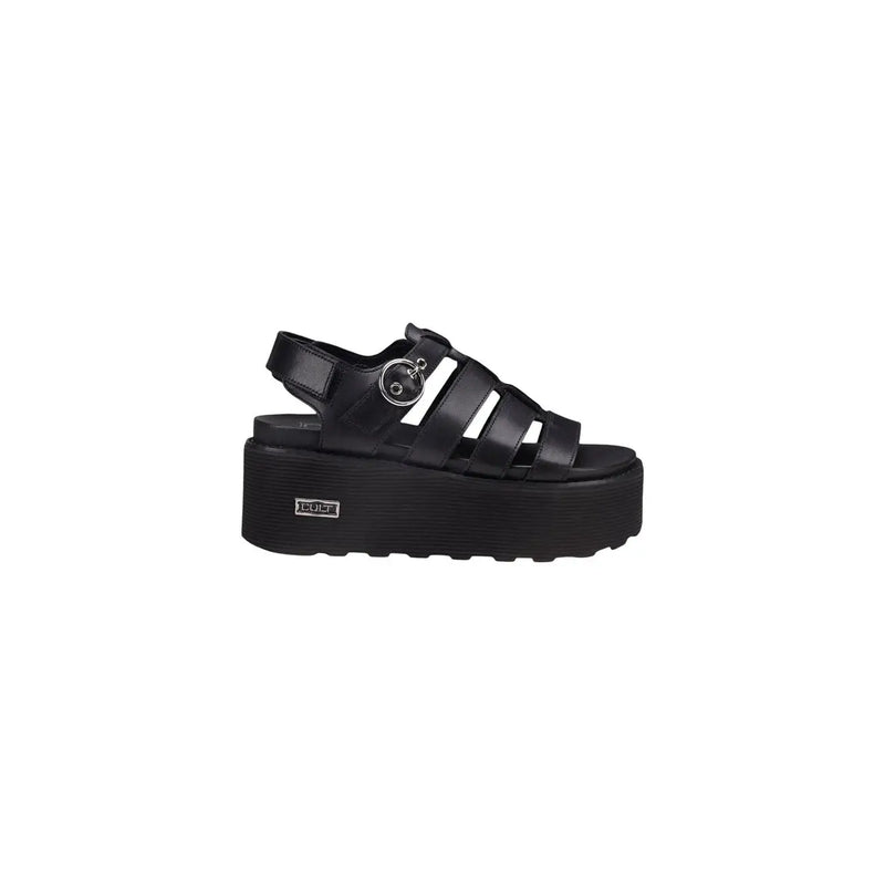 Black leather platform sandal with glossy upper multiple straps silver buckle and thick rubber sole cole logo visible
