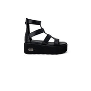 Black leather platform slip on sandal for women with multiple straps and a zipper closure on the back side