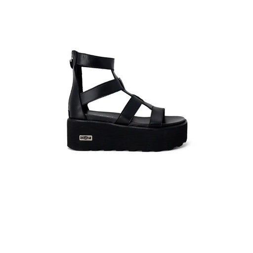 Black leather platform slip on sandal for women with multiple straps and a zipper closure on the back side