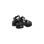 Black leather platform sandals with silver-toned bow buckles and chunky textured sole by Cult Women