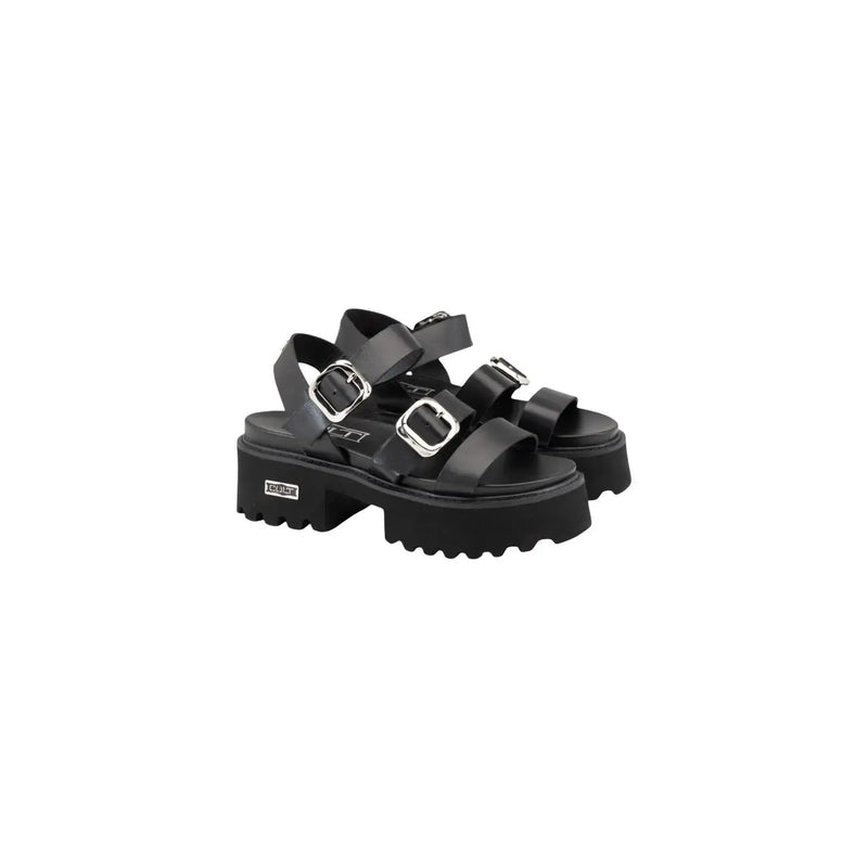 Black leather platform sandals with silver bow buckles and chunky textured sole by Cult Women