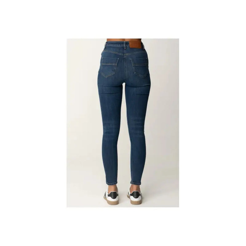 Dark wash blue denim high waisted skinny jeans with dark blue material and subtle thigh fading