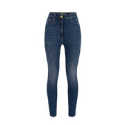 Dark wash blue denim high waisted skinny jeans with slim fit and gold tone button closure