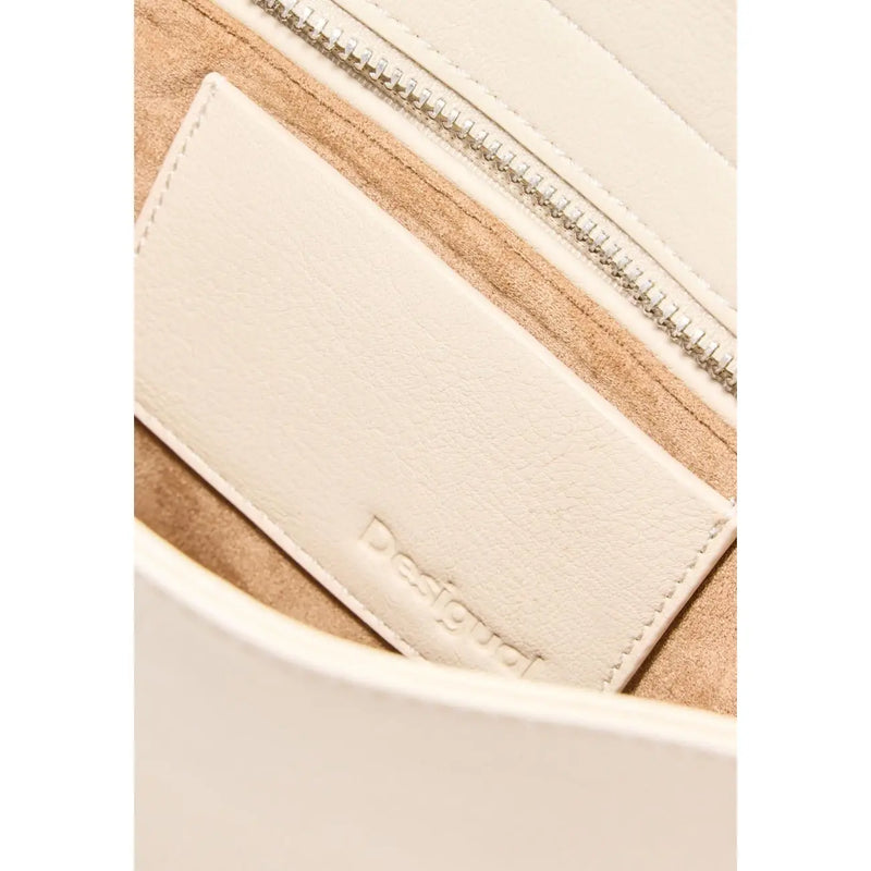 Cream-colored leather interior label embossed with desigual branding in beige polyester handbag with zip pocket