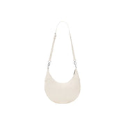 Cream-colored leather crescent-shaped crossbody bag with slender adjustable strap and silver hardware by desigual