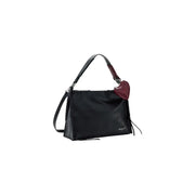 Desigual black leather handbag with shoulder strap, zip pockets, braided detailing, and burgundy heart-shaped charm