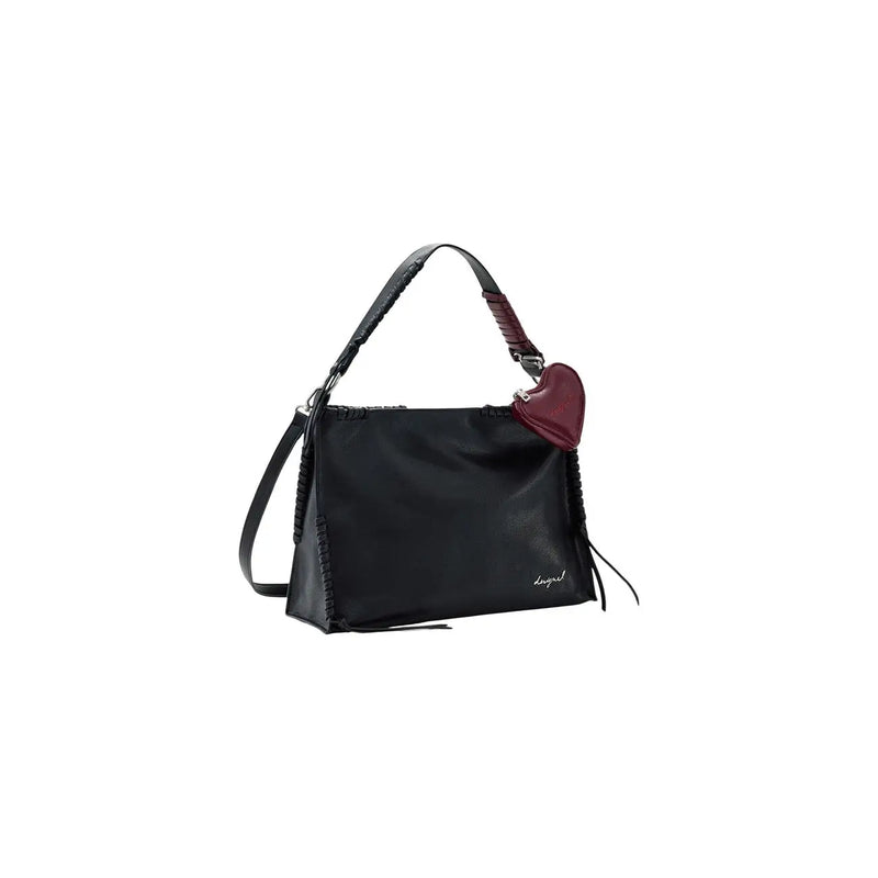 Desigual black leather handbag with shoulder strap, zip pockets, braided detailing, and burgundy heart-shaped charm