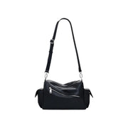 Black leather shoulder handbag with zippered main compartment and side pockets for stylish storage