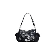 Black shoulder bag with white graffiti-style illustrations and multiple pockets