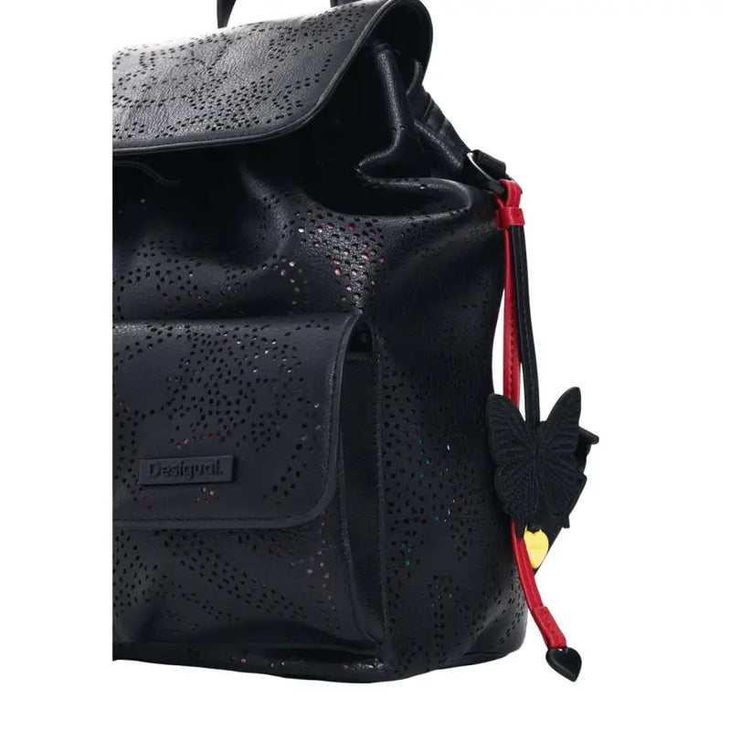 Desigual black perforated leather rucksack with pockets for women featuring a red strap and black butterfly charm