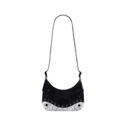 Black shoulder bag with curved shape studded accents and white snakeskin-patterned base