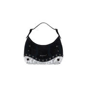 Black shoulder bag with white snakeskin trim, silver grommets, zip, and interior pocket