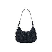 Desigual black leather hobo bag with quilted diamond pattern and dimensional floral appliqués featuring interior pocket