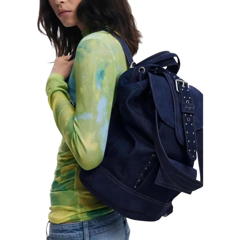 Navy blue denim backpack with silver-toned hardware and studded straps from Desigual blue women’s fall winter collection