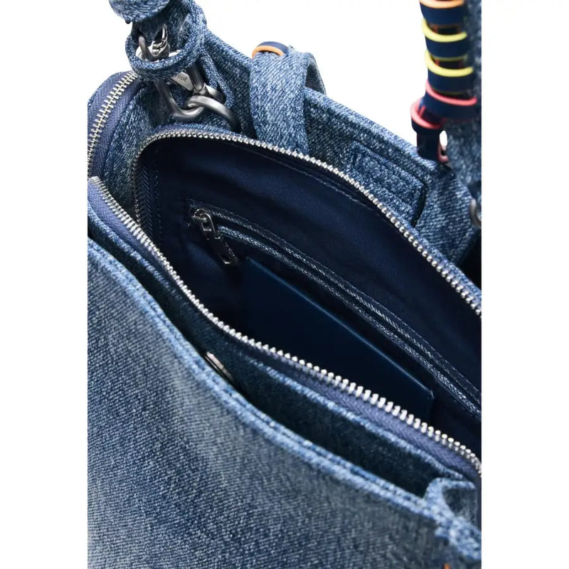 Denim blue Desigual zipper bag with pockets featuring a zipper-lined interior and colorful striped strap accents