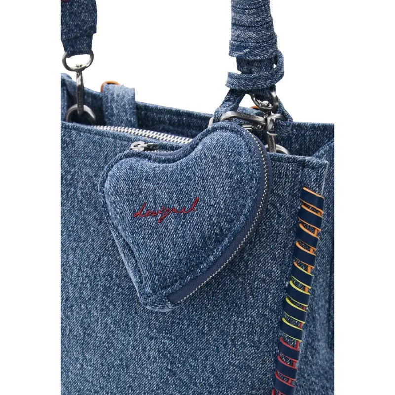 Desigual blue zippered bag with pockets featuring a denim heart-shaped charm with red embroidered logo on a blue tote