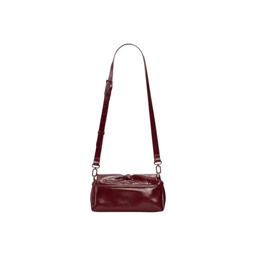 A sleek glossy burgundy leather Desigual bordeaux women crossbody bag with button closure and inside pocket