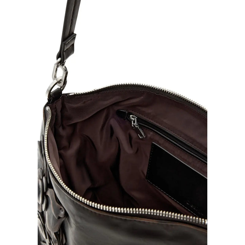 Black leather handbag with floral appliqué detailing and silver-toned zippers shown from the back side