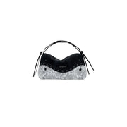 Black and white snakeskin print shoulder bag with silver grommets from Desigual Fall Winter collection