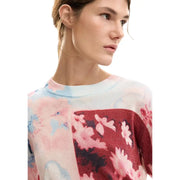 A soft knitted Desigual pink floral long sleeve round neck viscose knitwear with vibrant flowers in pink red and blue
