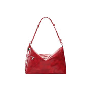 A glossy red polyester Desigual hobo handbag with braided chain strap and silver zipper accents and zip pockets