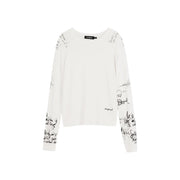 White long sleeve knitwear with black handwritten print featuring desigual label at the neckline for women