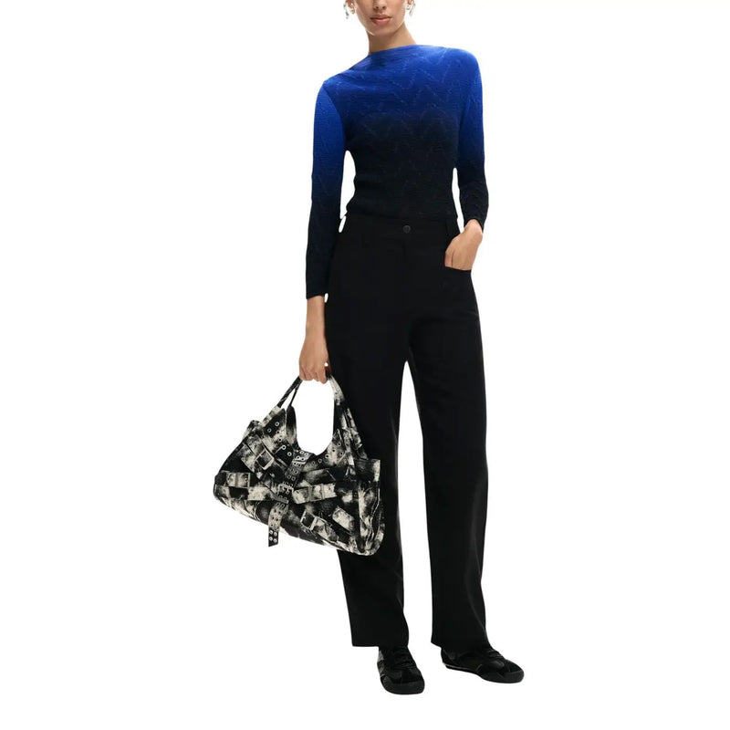 Desigual women black viscose trousers with pockets paired with a black and white patterned shoulder bag featuring overlapping belt buckles