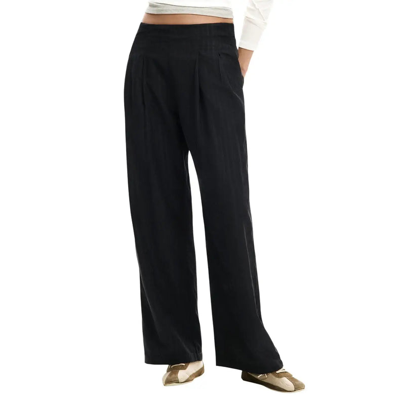 Black wide-leg zip trousers with high waist and pleated front made from polyester blend by Desigual