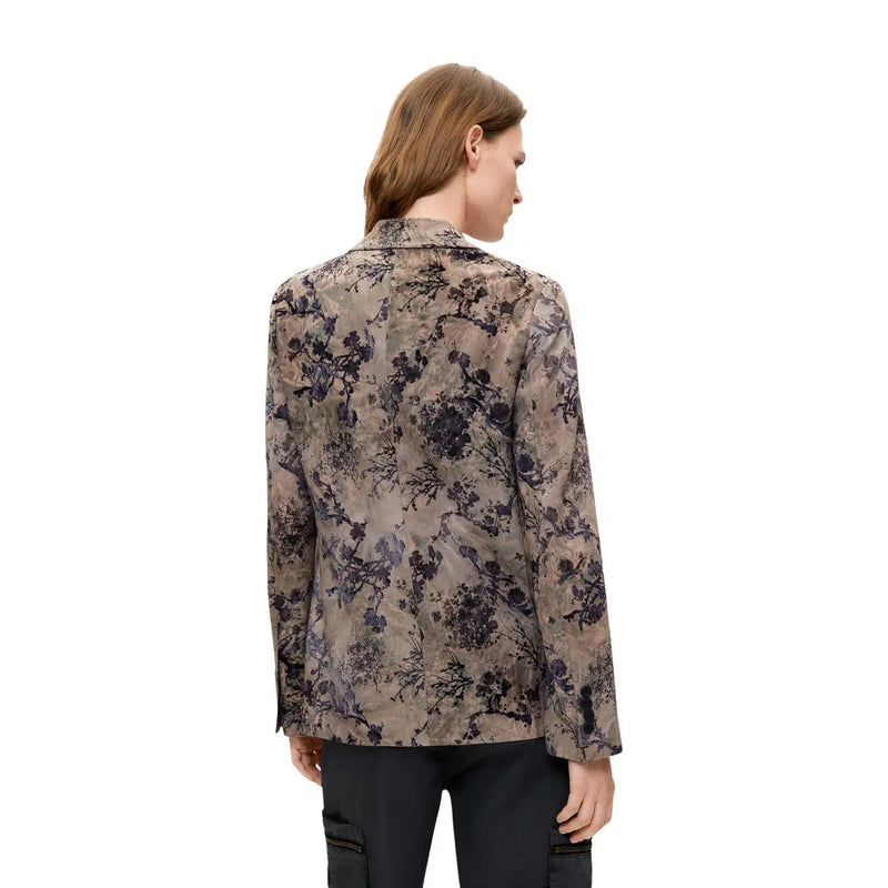 A woman wears a desigual women floral beige polyester blazer with long sleeves and elegant muted floral pattern